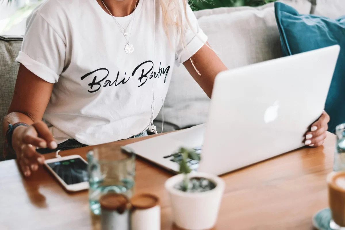 A person sitting in front of a laptop